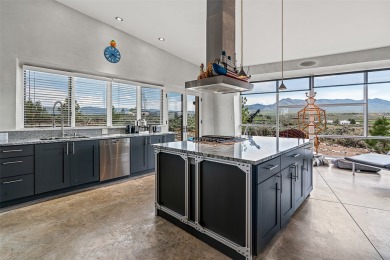 Live inside a work of art in this Artist's Dream Dwelling in on Taos Country Club in New Mexico - for sale on GolfHomes.com, golf home, golf lot