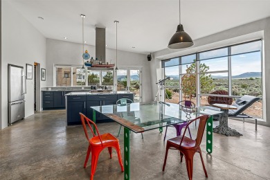 Live inside a work of art in this Artist's Dream Dwelling in on Taos Country Club in New Mexico - for sale on GolfHomes.com, golf home, golf lot