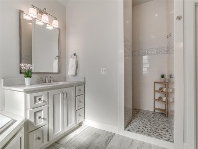 Blending elegance with everyday comfort, this stunning home is on Oak Tree National Golf and Country Club in Oklahoma - for sale on GolfHomes.com, golf home, golf lot