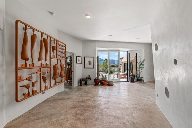 Live inside a work of art in this Artist's Dream Dwelling in on Taos Country Club in New Mexico - for sale on GolfHomes.com, golf home, golf lot