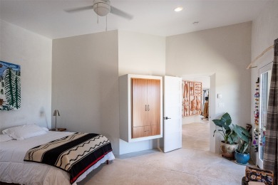 Live inside a work of art in this Artist's Dream Dwelling in on Taos Country Club in New Mexico - for sale on GolfHomes.com, golf home, golf lot