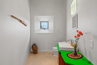 Live inside a work of art in this Artist's Dream Dwelling in on Taos Country Club in New Mexico - for sale on GolfHomes.com, golf home, golf lot