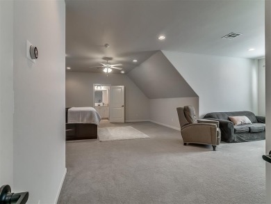 Blending elegance with everyday comfort, this stunning home is on Oak Tree National Golf and Country Club in Oklahoma - for sale on GolfHomes.com, golf home, golf lot