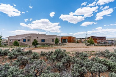 Live inside a work of art in this Artist's Dream Dwelling in on Taos Country Club in New Mexico - for sale on GolfHomes.com, golf home, golf lot
