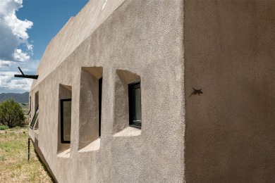 Live inside a work of art in this Artist's Dream Dwelling in on Taos Country Club in New Mexico - for sale on GolfHomes.com, golf home, golf lot