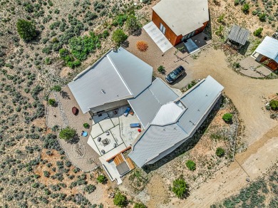 Live inside a work of art in this Artist's Dream Dwelling in on Taos Country Club in New Mexico - for sale on GolfHomes.com, golf home, golf lot