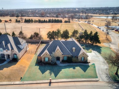 Blending elegance with everyday comfort, this stunning home is on Oak Tree National Golf and Country Club in Oklahoma - for sale on GolfHomes.com, golf home, golf lot