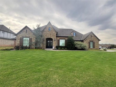 Blending elegance with everyday comfort, this stunning home is on Oak Tree National Golf and Country Club in Oklahoma - for sale on GolfHomes.com, golf home, golf lot