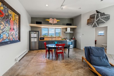 Live inside a work of art in this Artist's Dream Dwelling in on Taos Country Club in New Mexico - for sale on GolfHomes.com, golf home, golf lot