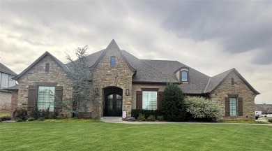 Blending elegance with everyday comfort, this stunning home is on Oak Tree National Golf and Country Club in Oklahoma - for sale on GolfHomes.com, golf home, golf lot