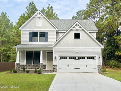 This stunning new 4-bedroom, 2.5-bath home in the gated Woodlake on Woodlake Country Club in North Carolina - for sale on GolfHomes.com, golf home, golf lot
