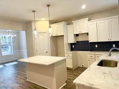 This stunning new 4-bedroom, 2.5-bath home in the gated Woodlake on Woodlake Country Club in North Carolina - for sale on GolfHomes.com, golf home, golf lot