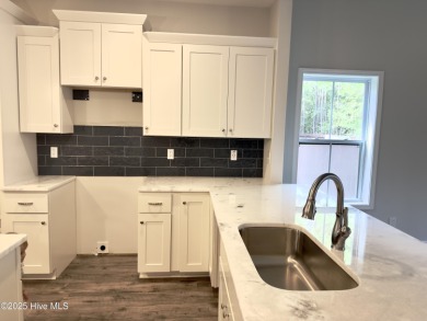 This stunning new 4-bedroom, 2.5-bath home in the gated Woodlake on Woodlake Country Club in North Carolina - for sale on GolfHomes.com, golf home, golf lot