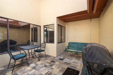 This exceptional end-unit townhome is strategically located on on The Grand Club - Pine Lakes Course in Florida - for sale on GolfHomes.com, golf home, golf lot
