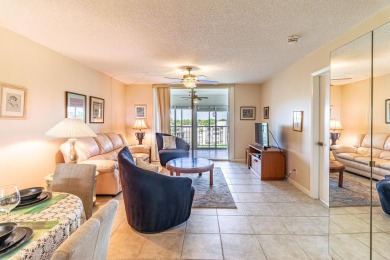Spectacular lake views abound in this waterfront condominium on Marina Lakes Golf Course in Florida - for sale on GolfHomes.com, golf home, golf lot