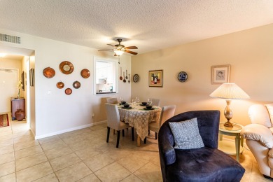 Spectacular lake views abound in this waterfront condominium on Marina Lakes Golf Course in Florida - for sale on GolfHomes.com, golf home, golf lot