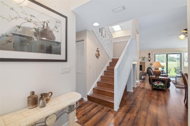 This exceptional end-unit townhome is strategically located on on The Grand Club - Pine Lakes Course in Florida - for sale on GolfHomes.com, golf home, golf lot
