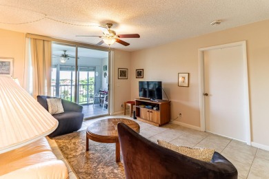 Spectacular lake views abound in this waterfront condominium on Marina Lakes Golf Course in Florida - for sale on GolfHomes.com, golf home, golf lot
