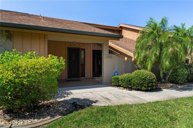 SPACIOUS POOL HOME OVERLOOKING GOLF COURSE IN LAKE SUZY on Kingsway Country Club in Florida - for sale on GolfHomes.com, golf home, golf lot
