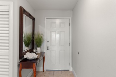 Wake up to serene lake views and step into the heart of on Signal Hill Golf Course, Inc. in Florida - for sale on GolfHomes.com, golf home, golf lot