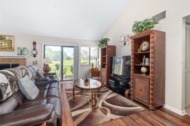 This exceptional end-unit townhome is strategically located on on The Grand Club - Pine Lakes Course in Florida - for sale on GolfHomes.com, golf home, golf lot
