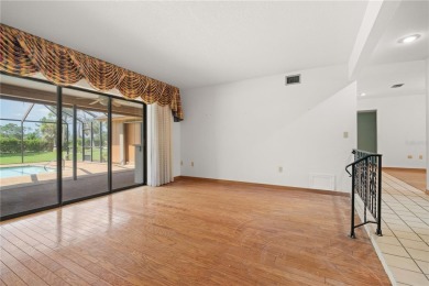 SPACIOUS POOL HOME OVERLOOKING GOLF COURSE IN LAKE SUZY on Kingsway Country Club in Florida - for sale on GolfHomes.com, golf home, golf lot