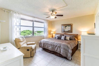 Spectacular lake views abound in this waterfront condominium on Marina Lakes Golf Course in Florida - for sale on GolfHomes.com, golf home, golf lot
