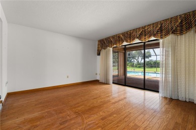 SPACIOUS POOL HOME OVERLOOKING GOLF COURSE IN LAKE SUZY on Kingsway Country Club in Florida - for sale on GolfHomes.com, golf home, golf lot