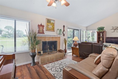 This exceptional end-unit townhome is strategically located on on The Grand Club - Pine Lakes Course in Florida - for sale on GolfHomes.com, golf home, golf lot