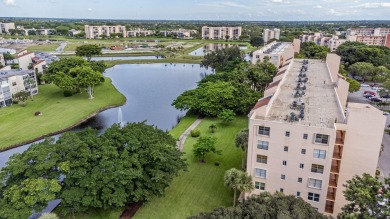 Spectacular lake views abound in this waterfront condominium on Marina Lakes Golf Course in Florida - for sale on GolfHomes.com, golf home, golf lot