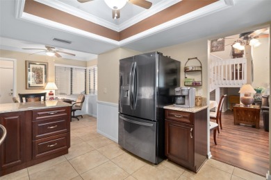 This exceptional end-unit townhome is strategically located on on The Grand Club - Pine Lakes Course in Florida - for sale on GolfHomes.com, golf home, golf lot