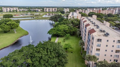 Spectacular lake views abound in this waterfront condominium on Marina Lakes Golf Course in Florida - for sale on GolfHomes.com, golf home, golf lot