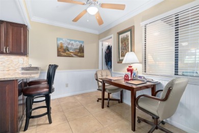 This exceptional end-unit townhome is strategically located on on The Grand Club - Pine Lakes Course in Florida - for sale on GolfHomes.com, golf home, golf lot