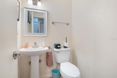 This exceptional end-unit townhome is strategically located on on The Grand Club - Pine Lakes Course in Florida - for sale on GolfHomes.com, golf home, golf lot