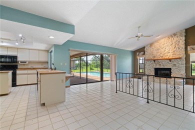 SPACIOUS POOL HOME OVERLOOKING GOLF COURSE IN LAKE SUZY on Kingsway Country Club in Florida - for sale on GolfHomes.com, golf home, golf lot