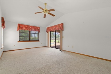 SPACIOUS POOL HOME OVERLOOKING GOLF COURSE IN LAKE SUZY on Kingsway Country Club in Florida - for sale on GolfHomes.com, golf home, golf lot