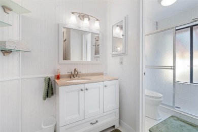 This exceptional end-unit townhome is strategically located on on The Grand Club - Pine Lakes Course in Florida - for sale on GolfHomes.com, golf home, golf lot