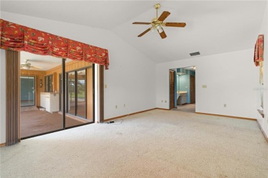 SPACIOUS POOL HOME OVERLOOKING GOLF COURSE IN LAKE SUZY on Kingsway Country Club in Florida - for sale on GolfHomes.com, golf home, golf lot