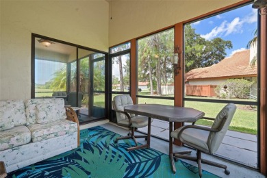 This exceptional end-unit townhome is strategically located on on The Grand Club - Pine Lakes Course in Florida - for sale on GolfHomes.com, golf home, golf lot