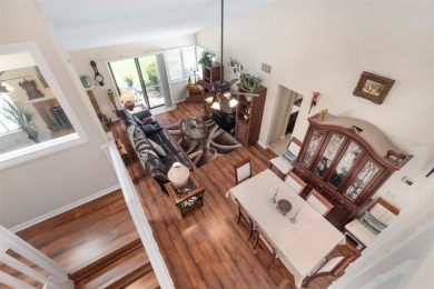 This exceptional end-unit townhome is strategically located on on The Grand Club - Pine Lakes Course in Florida - for sale on GolfHomes.com, golf home, golf lot