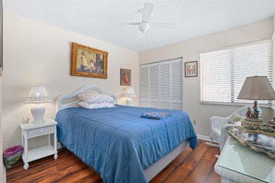 This exceptional end-unit townhome is strategically located on on The Grand Club - Pine Lakes Course in Florida - for sale on GolfHomes.com, golf home, golf lot