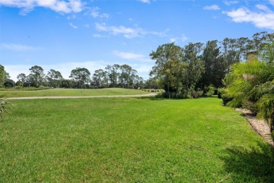 This exceptional end-unit townhome is strategically located on on The Grand Club - Pine Lakes Course in Florida - for sale on GolfHomes.com, golf home, golf lot