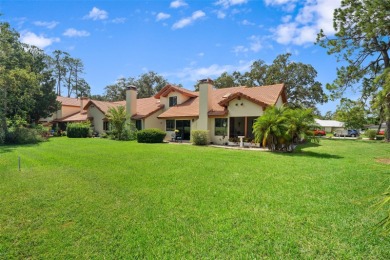 This exceptional end-unit townhome is strategically located on on The Grand Club - Pine Lakes Course in Florida - for sale on GolfHomes.com, golf home, golf lot