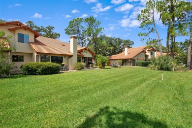 This exceptional end-unit townhome is strategically located on on The Grand Club - Pine Lakes Course in Florida - for sale on GolfHomes.com, golf home, golf lot