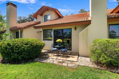 This exceptional end-unit townhome is strategically located on on The Grand Club - Pine Lakes Course in Florida - for sale on GolfHomes.com, golf home, golf lot