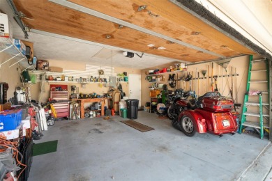 This exceptional end-unit townhome is strategically located on on The Grand Club - Pine Lakes Course in Florida - for sale on GolfHomes.com, golf home, golf lot