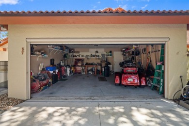 This exceptional end-unit townhome is strategically located on on The Grand Club - Pine Lakes Course in Florida - for sale on GolfHomes.com, golf home, golf lot