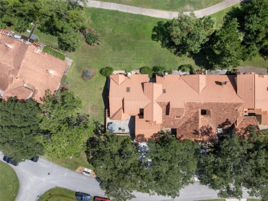 This exceptional end-unit townhome is strategically located on on The Grand Club - Pine Lakes Course in Florida - for sale on GolfHomes.com, golf home, golf lot