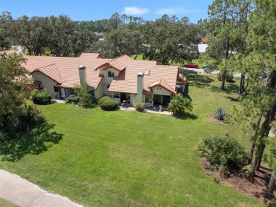 This exceptional end-unit townhome is strategically located on on The Grand Club - Pine Lakes Course in Florida - for sale on GolfHomes.com, golf home, golf lot