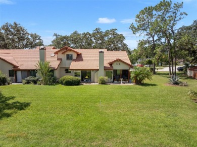 This exceptional end-unit townhome is strategically located on on The Grand Club - Pine Lakes Course in Florida - for sale on GolfHomes.com, golf home, golf lot